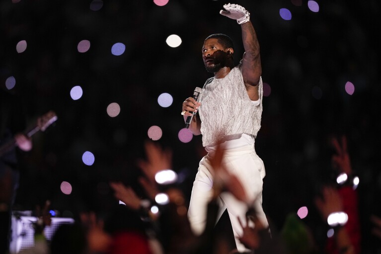 Usher performs during halftime of the NFL Super Bowl 58 football game between the San Francisco 49ers and the Kansas City Chiefs on Sunday, February 11, 2024, in Las Vegas.  (AP Photo/Brynn Anderson)