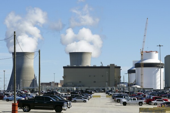 FILE - Reactors for Unit 3 and 4 sit at Georgia Power's Plant Vogtle nuclear power plant on Jan. 20, 2023, in Waynesboro, Ga., with the cooling towers of older Units 1 and 2 billowing steam in the background. A federal appeals court ruled Friday, Nov. 24, that Georgia could keep statewide elections for its public service commissioners, who oversee Georgia Power. (AP Photo/John Bazemore, File)