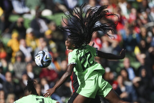 Nigeria's Michelle Alozie heads the ball during the Women's World Cup Group B soccer match between Nigeria and Canada in Melbourne, Australia, Friday, July 21, 2023. (AP Photo/Hamish Blair)