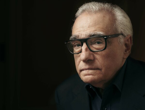 FILE- In this Dec. 9, 2016 file photo, producer and director Martin Scorsese poses for a portrait in New York.  Scorsese’s latest film, “Rolling Thunder Revue: A Bob Dylan Story By Martin Scorsese,” is a blistering semi-fictional documentary that resurrects Dylan’s mythic 1975-1976 tour and its rambling cavalcade across a post-Vietnam America. The film, which opens Wednesday in limited theaters and on Netflix, includes restored performance footage, scenes of the backstage circus and interviews with many of the participants, including Dylan’s first on-camera interview in 10 years. (Photo by Victoria Will/Invision/AP, File)