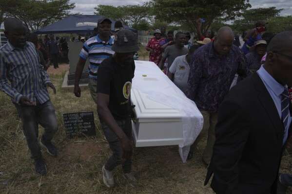At the funeral of a slain Zimbabwean activist, clashes and a low turnout mirror opposition decline 