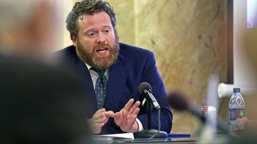FILE - Drew Snyder, executive director of the Mississippi Division of Medicaid, gives an agency update to members of the House Medicaid Committee at the state Capitol, Jan. 23, 2019, in Jackson, Miss. The division announced, Monday, July 10, 2023, that it has started removing thousands of people from the program after the end of a pandemic public health emergency. (AP Photo/Rogelio V. Solis, File)