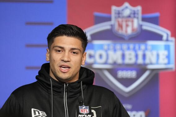 Mississippi quarterback Matt Corral speaks during a press conference at the NFL football scouting combine, Wednesday, March 2, 2022, in Indianapolis. (AP Photo/Darron Cummings)