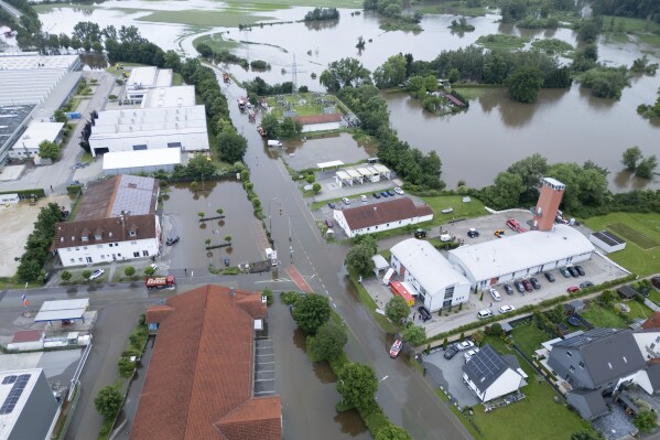 Sections of the city are flooded by water, in Reichertshofen, Germany, Sunday, June 2, 2024. (Sven Hoppe/dpa via AP)