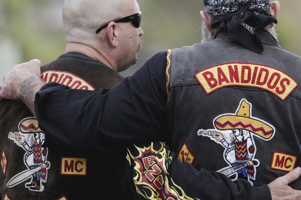 FILE - Members of the Bandidos wait in front of the court in Muenster, western Germany, Tuesday, June 10, 2008. Denmark wants a court of law to dissolve the Danish arm of the Bandidos motorcycle club, with the justice minister citing the group members’s criminal activities. Justice Minister Peter Hummelgaard said Wednesday that "their brutal behavior leaves bloody traces.” (AP Photo/Roberto Pfeil, File)