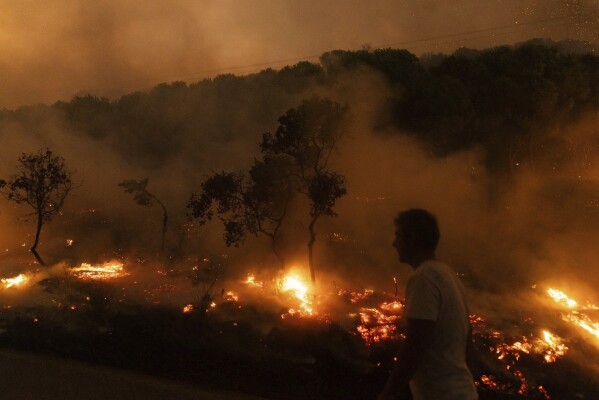 FILE - A wildfire burns in the village of Dikela, near Alexandroupolis town, in the northeastern Evros region, Greece, Aug. 22, 2023. Europe is facing growing climate risks and is unprepared for them, the European Environment Agency said in its first-ever risk assessment for the bloc Monday, March 11, 2024. (AP Photo/Achilleas Chiras, File)
