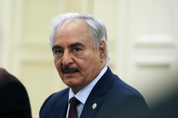 FILE - Libyan Gen. Khalifa Hifter joins a meeting with the Greek Foreign Minister Nikos Dendias in Athens, Greece, Jan. 17, 2020. The Libyan military commander who once lived in Virginia sat for a deposition Sunday, Nov. 6, 2022, in a U.S. lawsuit in which he is accused of orchestrating indiscriminate attacks on civilians and torturing and killing political opponents, according to an advocacy group that supports the lawsuit. (AP Photo/Thanassis Stavrakis, File)