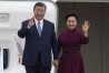 China's President Xi Jinping and his wife Peng Liyuan wave as they arrive Sunday, May 5, 2024 at Orly airport, south of Paris. French President Emmanuel Macron will seek to press China's Xi Jinping to use his influence on Moscow to move towards the end of the war in Ukraine, during a two-day state visit to France that will also see both leaders discuss trade issues. (AP Photo/Michel Euler, Pool)