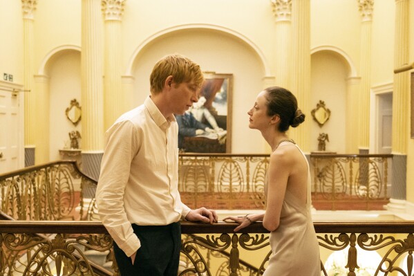 This image released by PBS shows Domhnall Gleeson, left, and Andrea Riseborough in a scene from MASTERPIECE "Alice & Jack," premiering Sunday March 17 on PBS. (Jack Merriman/Fremantle/PBS via AP)