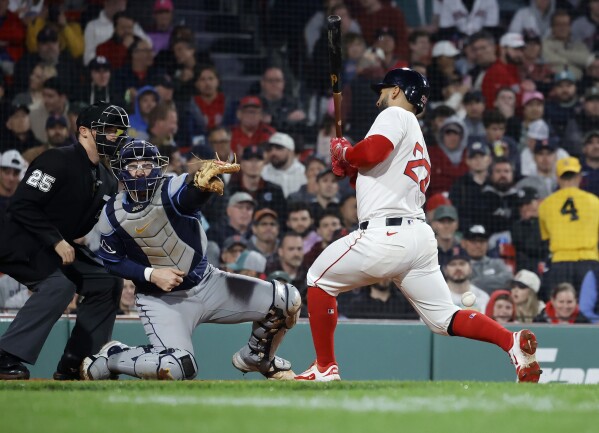 Boston Red Sox's Kristian Campbell (28) reacts after being hit by a pitch as Tampa Bay Rays catcher Danny Jansen (19) looks on during the sixth inning of a baseball game at Fenway Park, Monday, June 9, 2025, in Boston. (AP Photo/Mary Schwalm)
