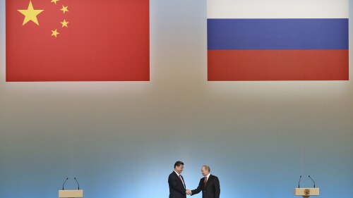FILE - Russian President Vladimir Putin, right, and Chinese President Xi Jinping shake hands at the opening ceremony of the Year of Chinese tourism in Russia, in the Kremlin in Moscow, Friday, March 22, 2013. China's muted reaction to the Wagner mercenary group uprising against Russia's military belies Beijing's growing anxieties over the war in Ukraine and how this affects the global balance of power. (AP Photo/Sergei Ilnitsky, Pool, File)