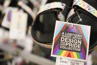 Pride month merchandise is displayed at the front of a Target store in Hackensack, N.J., Wednesday, May 24, 2023. The Associated Press on Friday, June 2, 2023 reported on social media posts falsely claiming that satanic-themed apparel from a London-based designer are part of Target’s Pride month collection. (AP Photo/Seth Wenig)