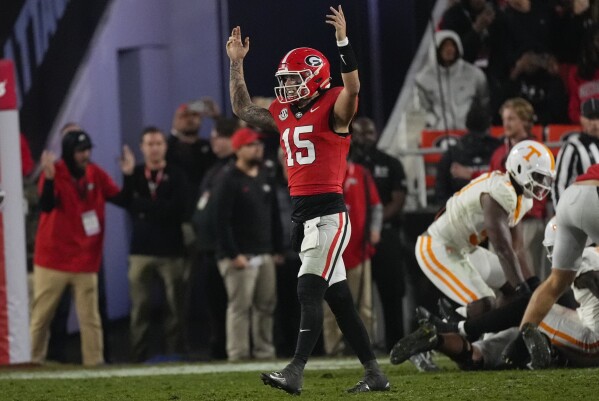 Georgia quarterback Carson Beck (15) reacts after a Georgia touchdown during the second half of an NCAA college football game against Tennessee, Saturday, Nov. 16, 2024, in Athens, Ga. (AP Photo/John Bazemore)