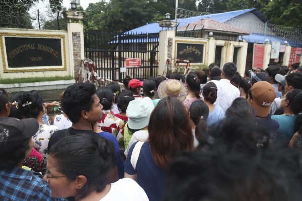 File - Family members and colleagues wait to welcome released prisoners from Insein Prison in Yangon, Myanmar Tuesday, Aug. 1, 2023. Military-ruled Myanmar on Tuesday, Oct. 24, 2023, allowed prisoners to have visitors from outside, a right that had been suspended for 3 1/2 years due to the coronavirus pandemic, the military's information office and prison officials said. (AP Photo/Thein Zaw)