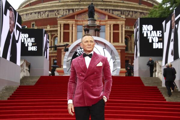 Daniel Craig poses for photographers upon arrival for the World premiere of the new film from the James Bond franchise 'No Time To Die', in London Tuesday, Sept. 28, 2021. (Photo by Joel C Ryan/Invision/AP)