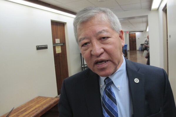 FILE - Honolulu Prosecuting Attorney Keith Kaneshiro talks to The Associated Press in Honolulu, March 2, 2016. A jury found Honolulu's former top prosecutor, Kaneshiro, not guilty, Friday, May 17, 2024, in a bribery case that alleged employees of an engineering and architectural firm bribed him with campaign donations in exchange for his prosecution of a former company employee. (AP Photo/Cathy Bussewitz, File)