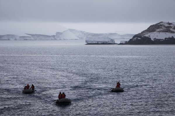Zodiac boats sail in the Bransfield Strait towards the Bernardo O'Higgins Chilean military base in Antarctica, Thursday, Nov. 23, 2023. (AP Photo/Jorge Saenz)