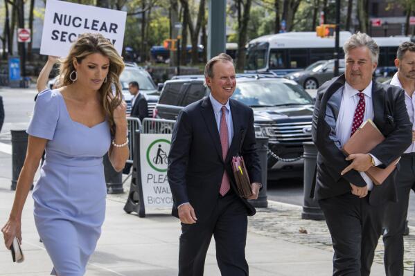 CORRECTS SPELLING OF FIRST NAME TO LINDSEY INSTEAD OF LINSEY AND CLARIFIES THAT KISE IS AT CENTER AND TRUSTY IS AT RIGHT - Former President Donald Trump's attorneys Lindsey Halligan, left, Chris Kise, center, and James Trusty arrive at Brooklyn Federal Court, Tuesday, Sept. 20, 2022, in New York. Lawyers for Trump and for the Justice Department are to appear in federal court in Brooklyn on Tuesday before a veteran judge named last week as special master to review the roughly 11,000 documents — including about 100 marked as classified — taken during the FBI's Aug. 8 search of Mar-a-Lago.  (AP Photo/Brittainy Newman)