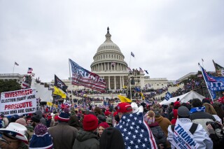FILE - Insurrections loyal to President Donald Trump rally at the U.S. Capitol in Washington on Jan. 6, 2021. Ray Epps, an Arizona man who became the center of a conspiracy theory about Jan. 6, 2021, has been charged with a misdemeanor offense in connection with the U.S. Capitol riot, according to court papers filed Tuesday. Epps is charged with a single count of a disorderly or disruptive conduct on restricted grounds. (AP Photo/Jose Luis Magana, File)