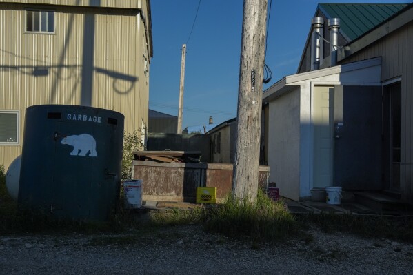 A dumpster sits outside of the Tundra Pub, Tuesday, Aug. 6, 2024, in Churchill, Manitoba. (AP Photo/Joshua A. Bickel)