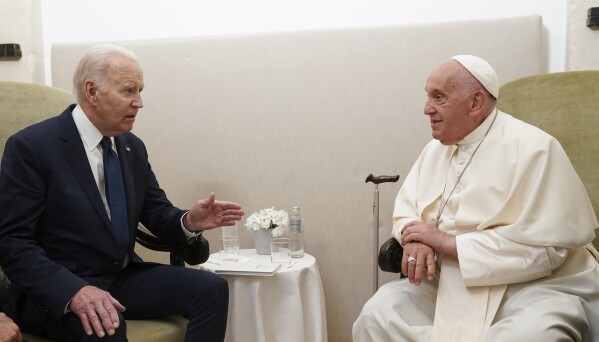 U.S. President Joe Biden meets with Pope Francis on the second day of the G7 summit at the Borgo Egnazia resort, in Savelletri, Puglia, Italy, Friday June 14, 2024. (Kevin Lamarque/Pool Photo via AP)