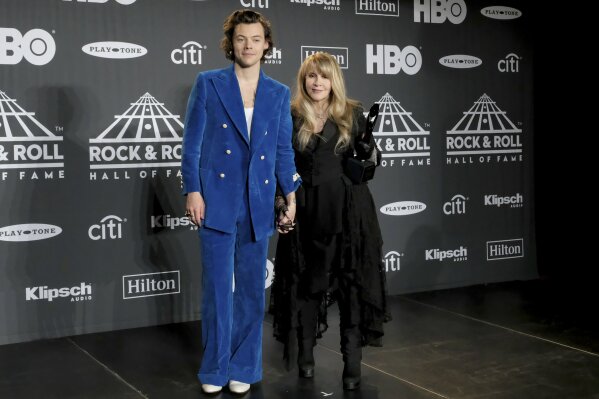 
              Harry Styles, left, and inductee Stevie Nicks pose in the press room at the Rock & Roll Hall of Fame induction ceremony at the Barclays Center on Friday, March 29, 2019, in New York. (Photo by Charles Sykes/Invision/AP)
            