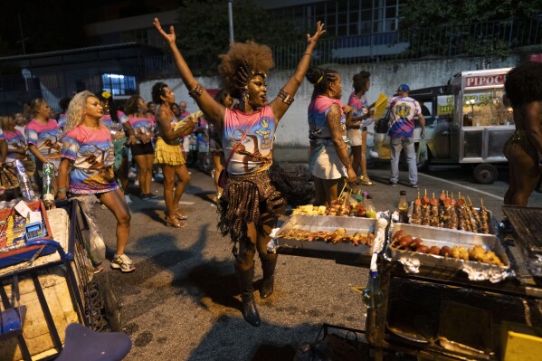 Transgender woman Negriny Venture dances during a Paraiso de Tuiuti samba school rehearsal for Carnival in Rio de Janeiro, Monday, Feb. 17, 2025. (AP Photo/Silvia Izquierdo)