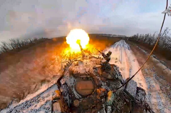 FILE - In this photo taken from video and released by the Russian Defense Ministry Press Service on Thursday, Feb. 8, 2024, a Russian tank fires in an undisclosed location in Ukraine. As the Kremlin watches signs of crumbling Western support for Ukraine, the Russian military has pressed attacks in several sectors in a bid to drain Kyiv's reserves and deplete its munitions. (Russian Defense Ministry Press Service via 麻豆传媒app, File)