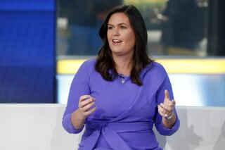 FILE - In this Friday, Sept. 6, 2019, file photo, Fox News contributor Sarah Sanders makes her first appearance on the "Fox & Friends" television program in New York. Former White House press secretary Sanders is laying the groundwork for a possible run for governor of Arkansas in 2022. (AP Photo/Richard Drew, File)