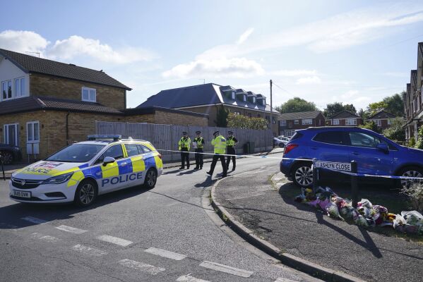 Police officers at the scene in Ashlyn Close where three women were killed in a crossbow attack at their home, on Tuesday, in Bushey, England, Thursday, July 11, 2024. (Jonathan Brady/PA via AP)