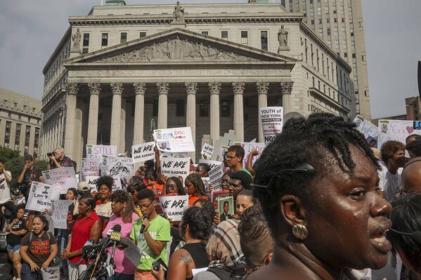 FILE - A rally of mostly young people protest in Federal Plaza against the decision by federal prosecutors not to bring civil rights charges against New York City police officer Daniel Pantaleo for the 2014 chokehold death of Eric Garner, July 17, 2019, in New York. On Monday, Nov. 20, 2023, New York's highest court upheld a New York City law that forbids police from using chokeholds or compressing a person's diaphragm during an arrest, rejecting a challenge from police unions to a law passed after the death of George Floyd. (AP Photo/Bebeto Matthews, File)