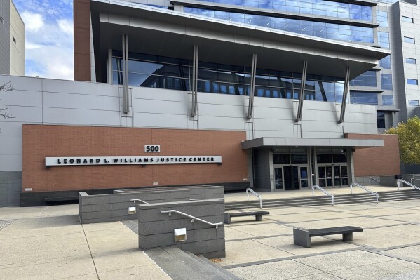 Signage marks the exterior of the New Castle County Courthouse, Tuesday, Oct. 31, 2023, in Wilmington, Del. The courthouse is the scene of a trial that began Monday, Oct. 30, for Keith Gibson, an alleged serial killer suspected in the deaths of several people in Delaware and Pennsylvania. (AP Photo/Randall Chase)