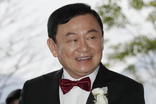 FILE - Former Thai Prime Minister Thaksin Shinawatra welcomes his guests for the wedding of his youngest daughter Paetongtarn "Ing" Shinawatra at a hotel in Hong Kong on March 22, 2019. Thailand's self-exiled former Prime Minister Thaksin Shinawatra said Tuesday, May 9, 2023. that he wants to come home by this July. (AP Photo/Kin Cheung, File)