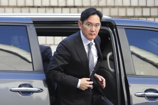 FILE - In this Nov. 22, 2019, file photo, Samsung Electronics Vice Chairman Lee Jae-yong gets out of a car at the Seoul High Court in Seoul, South Korea. A day ahead of his release on parole, billionaire Samsung scion Lee Jae-yong appeared in court Thursday, Aug. 12, 2021, for an ongoing trial over charges of financial crimes, a reminder of his looming legal risks even as he leaves prison.(AP Photo/Ahn Young-joon, File)
