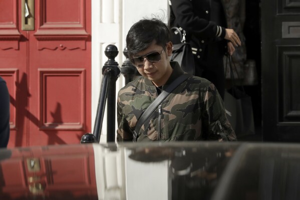 FILE - Vorayuth "Boss" Yoovidhya, whose grandfather co-founded energy drink company Red Bull, walks to get in a car as he leaves a house in London, Wednesday, April 5, 2017. State prosecutors in Thailand announced Tuesday, Feb. 27, 2024. They will indict a former national Police chief Gen. Somyot Poompanmoung on charges of impeding legal action against an heir to the Red Bull energy drink fortune who was accused of killing a Bangkok police officer in a 2012 hit-and-run. (AP Photo/Matt Dunham, File)