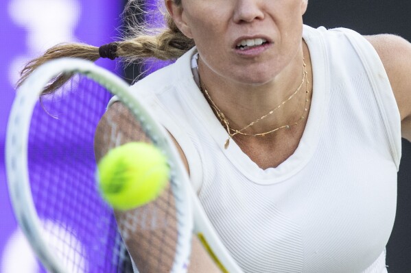 Danielle Collins returns the ball in a match against Ons Jabeur at the Charleston Open tennis tournament Thursday, April 4, 2024, in Charleston, S.C. (Henry Taylor/The Post And Courier via AP)