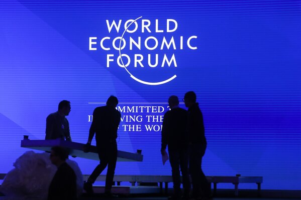 
              People set up the main stage at the congress center where the annual meeting of the World Economic Forum 2019, WEF, take place in Davos, Sunday, Jan. 20, 2019. (AP Photo/Markus Schreiber)
            