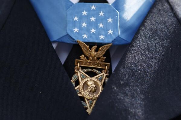 FILE - The Medal of Honor is seen around the neck of Medal of Honor recipient Army Staff Sgt. David Bellavia outside the West Wing of the White House in Washington, June 25, 2019. One of the first Black officers to lead a Special Forces team in combat will receive the Medal of Honor, the nation's highest award for bravery on the battlefield, nearly 60 years after he distinguished himself during the Vietnam War. President Joe Biden telephoned ret. U.S. Army Col. Paris Davis on Monday, Feb. 13, 2023, “to inform him that he will receive the Medal of Honor for his remarkable heroism during the Vietnam War.” (AP Photo/Carolyn Kaster, File)