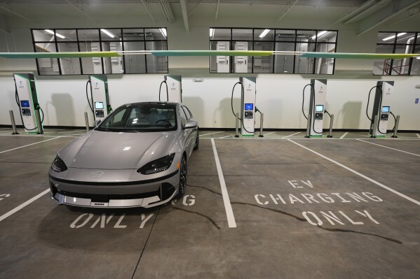 Charging bays are seen at the new Electrify America indoor electric vehicle charging station in San Francisco, Wednesday, Feb. 7, 2024. (AP Photo/Eric Risberg, File)