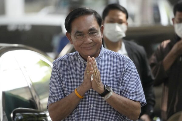 FILE - Thailand's Prime Minister Prayuth Chan-ocha arrives to cast his vote during a general election at a polling station in Bangkok, Thailand, on May 14, 2023. Prayuth, who served almost nine years in office after seizing power in a 2014 military coup, announced Tuesday, July 11, that he is leaving politics. (AP Photo/Sakchai Lalit, File)