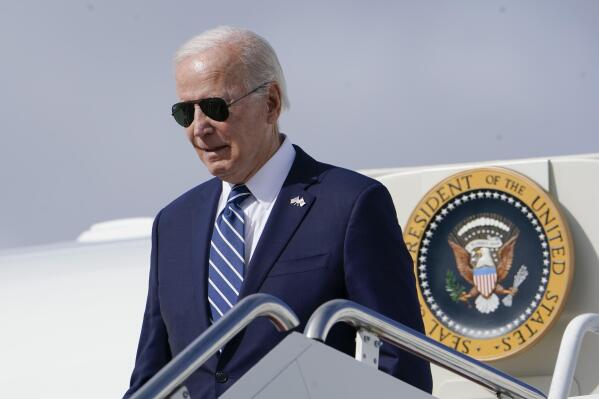 President Joe Biden exits Air Force One as he arrives at Hancock Field Air National Guard Base in Mattydale, N.Y., Thursday, Oct. 27, 2022. Biden traveling to visit the Micron chip facility in Syracuse, N.Y. (AP Photo/Manuel Balce Ceneta)