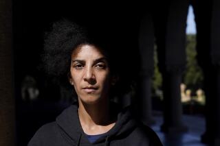 Timnit Gebru poses for photos in Stanford, Calif., Monday, March 21, 2022. When she co-led Google's Ethical AI team, Gebru was a prominent insider voice questioning the tech industry's approach to artificial intelligence. (AP Photo/Jeff Chiu)