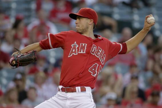 Los Angeles Angels starting pitcher Tyler Skaggs throws against the Detroit Tigers during the first inning of a baseball game in Anaheim, Calif., Friday, July 25, 2014. (AP Photo/Chris Carlson)