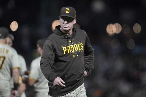San Diego Padres manager Bob Melvin walks to the dugout after making a pitching change during the seventh inning of a baseball game against the San Francisco Giants in San Francisco, Monday, Sept. 25, 2023. (AP Photo/Jeff Chiu)