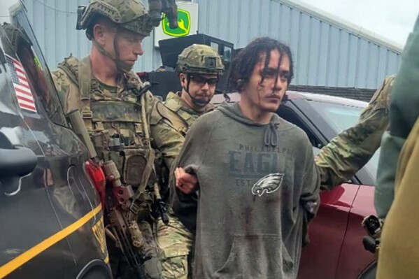 Danelo Souza Cavalcante is taken into custody at the Pennsylvania State Police barracks at Avondale Pa., on Wednesday, Sept. 13, 2023. Cavalcante was captured Wednesday after eluding hundreds of searchers for two weeks.(Pennsylvania State Police via AP)
