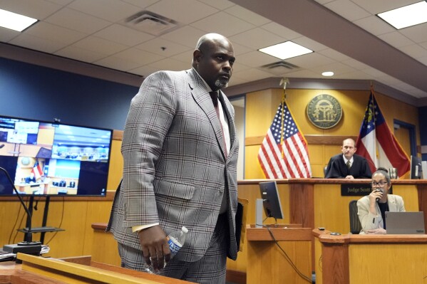 Terrence Bradley leaves the stand after testifying, Tuesday, Feb. 27, 2024, in Atlanta. Bradley, special prosecutor Nathan Wade’s former law partner and onetime divorce attorney, testified as a judge considered an effort by lawyers for former President Donald Trump to disqualify Fulton County District Attorney Fani Willis over her romantic relationship with Wade. (AP Photo/Brynn Anderson, Pool)