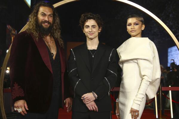 Jason Momoa, from left, Timothee Chalamet, and Zendaya pose for photographers upon arrival at the premiere of the film 'Dune' on Monday, Oct. 18, 2021 in London. (Photo by Joel C Ryan/Invision/AP)