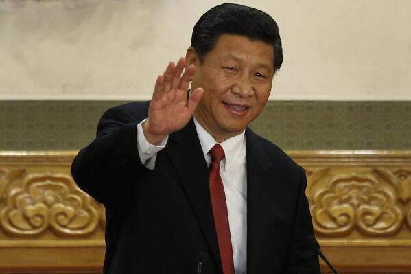 FILE - New Communist Party General Secretary Xi Jinping waves in Beijing's Great Hall of the People on Nov. 15, 2012. When Xi Jinping came to power in 2012, it wasn't clear what kind of leader he would be. His low-key persona during a steady rise through the ranks of the Communist Party gave no hint that he would evolve into one of modern China's most dominant leaders, or that he would put the economically and militarily ascendant country on a collision course with the U.S.-led international order. (AP Photo/Vincent Yu, File)