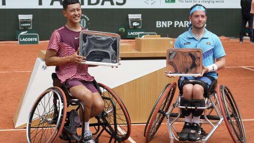 Champion Japan's Tokito Oda, left, and runner-up Britain's Alfie Hewett pose with thir trophies after the final match of the Men's Wheelchair Singles French Open tennis tournament at the Roland Garros stadium in Paris, Saturday, June 10, 2023. (AP Photo/Christophe Ena)