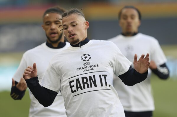 Leeds United's Kalvin Phillips warms up ahead of ahead of the English Premier League soccer match between Leeds United and Liverpool at the Elland Road stadium in Leeds, England, Monday, April 19, 2021. (Clive Brunskill/Pool via AP)